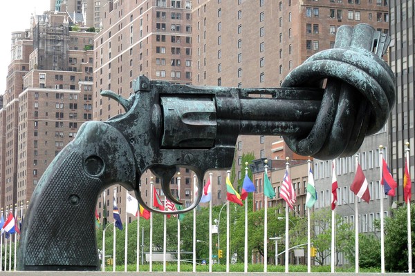 A sculpture of a 45-caliber revolver with its barrel knotted, titled Non-Violence but frequently referred to as the 